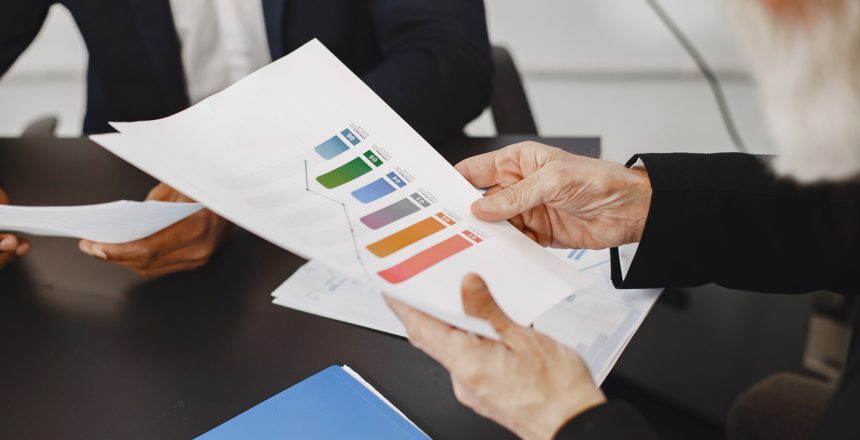 African man in a black suit. International partners. Young guy with senior man.